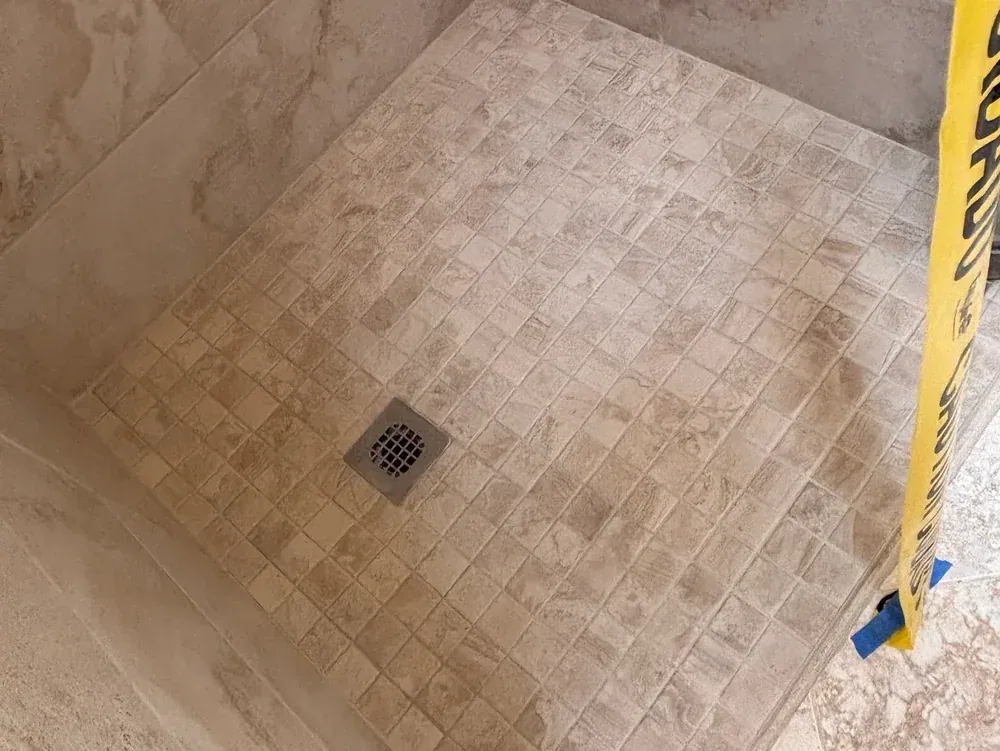 Shower base with mosaic tile after cleaning